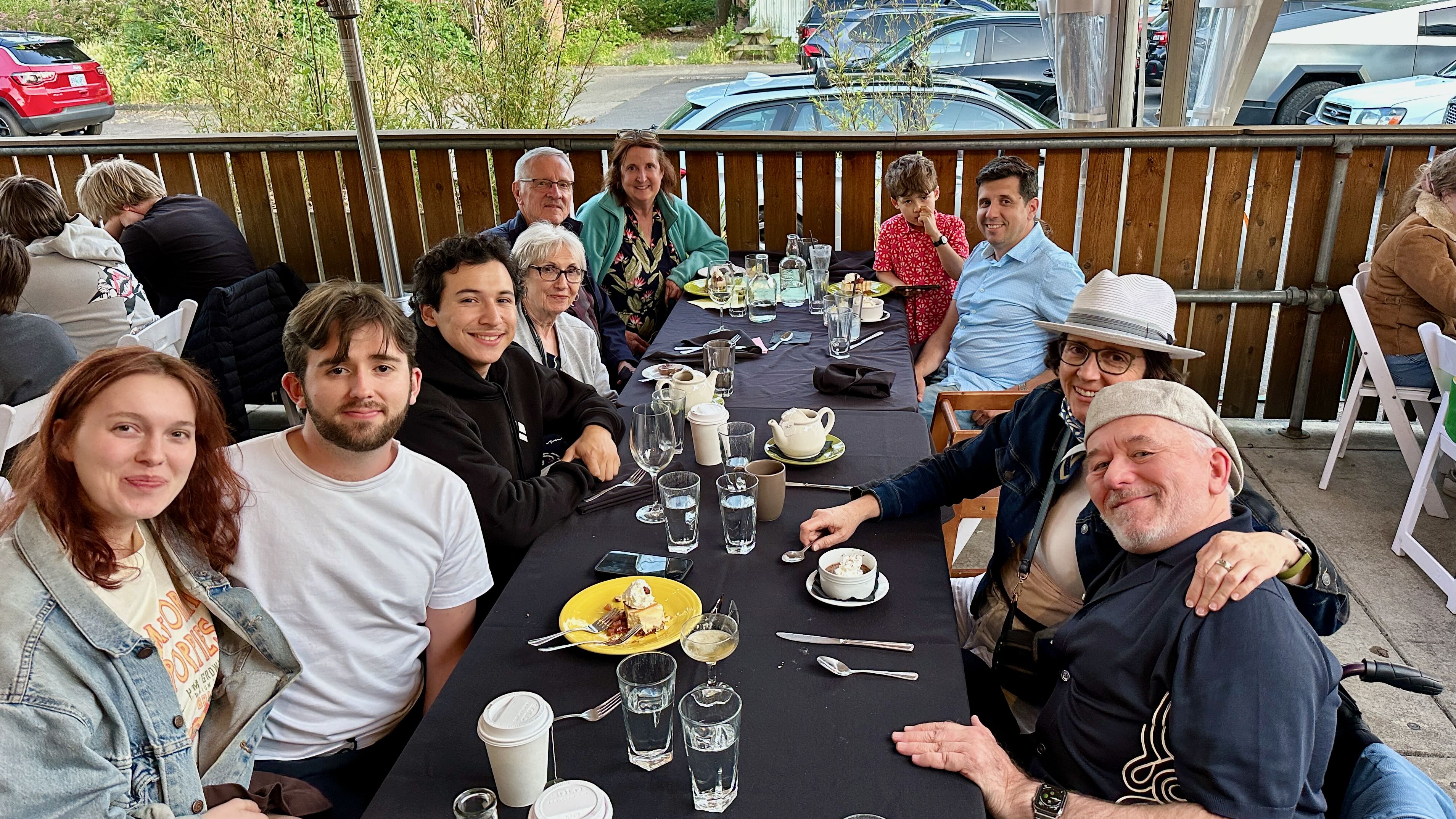 The graduation dinner that sparked Disability Night Out — family and friends gathered at an outdoor restaurant table