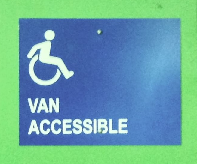 Van Accessible sign with Active ISA at the de Young Museum